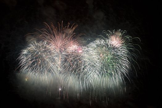 Firework display against black sky