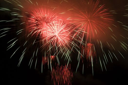 Firework display against black sky