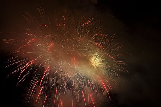 Firework display against black sky