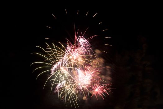 Firework display against black sky