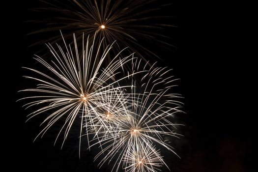 Firework display against black sky