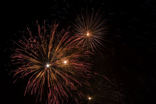 Firework display against black sky