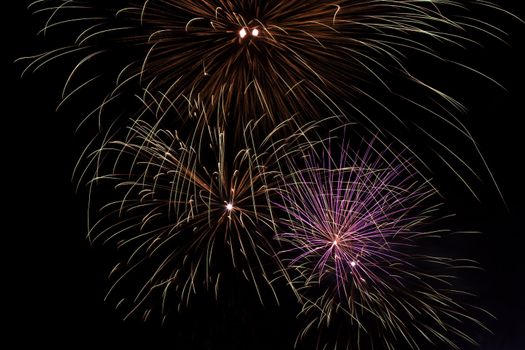 Firework display against black sky