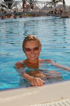 Beautiful woman in a swimming pool.