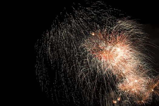 Firework display against black sky