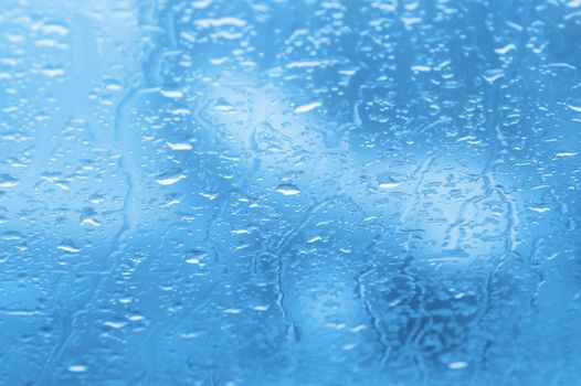  Rain drops on a window of car