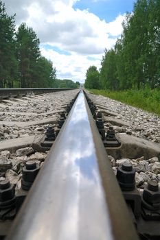 Old steel railroad tracks close-up macro with reflection