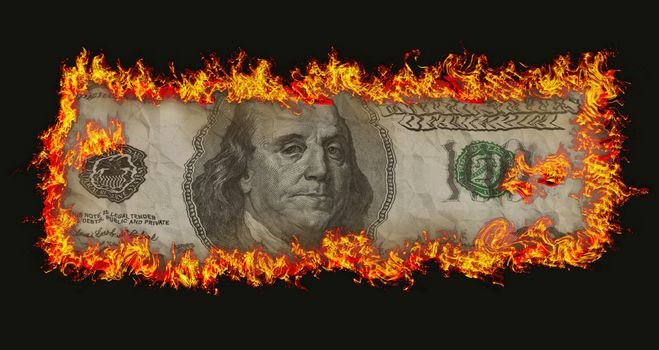 burning old hundred banknote on black bacground