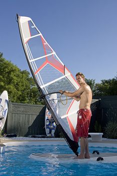 Windsurfer in a backyard pool