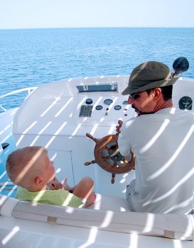 little boy and captain on the boat 