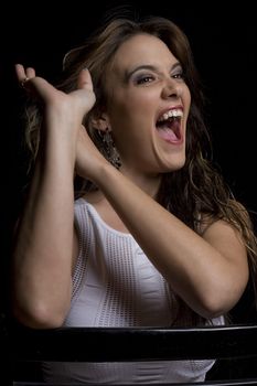 Young women, in her twenties, with her hand stuck in her hair and trying to pull it out