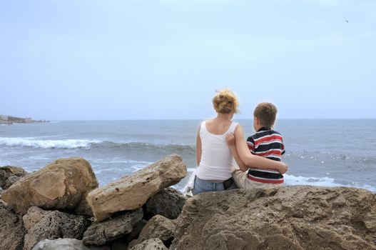 Family on the beach caribbean sea. ma and son.