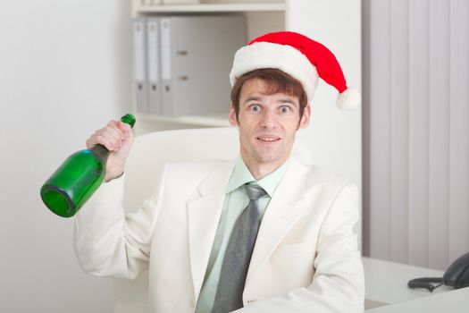 The young businessman in a white jacket celebrates Christmas