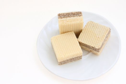 Wafers on a plate on a white background removed close up. Not isolated