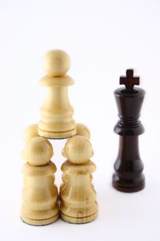 Group of pawns attacking the queen removed close up