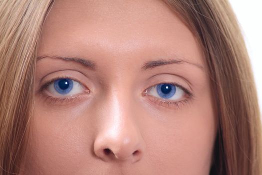 Part of the person of the nice girl with blue eyes removed close up