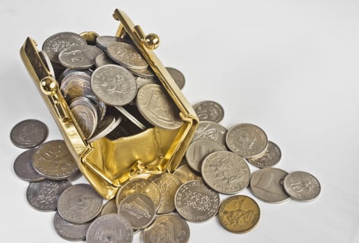 A golden colored bag filled with coins 