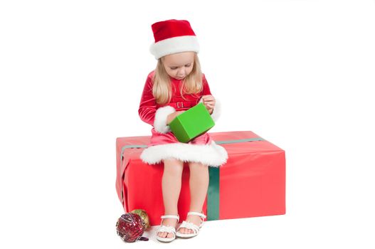 Christmas toddler with present boxes, studio shot