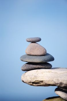 Several cobble-stones at the edge of a cliff