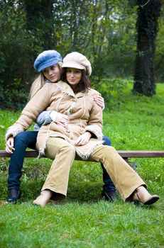 two cute girls having fun outdoors in autumn