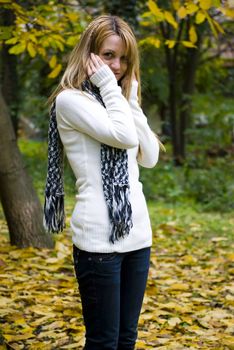 beautiful young woman outdoors portrait in autumn fashion