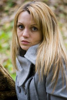 beautiful young woman outdoors portrait in autumn fashion