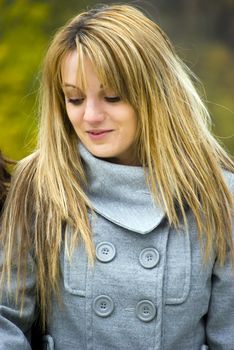 beautiful young woman outdoors portrait in autumn fashion