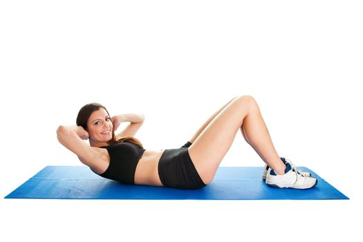 Fitness woman doing crunches on gym mat. Isolated on white