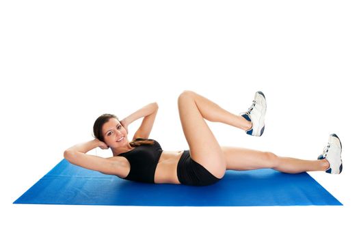 Fitness woman doing crunches on gym mat. Isolated on white