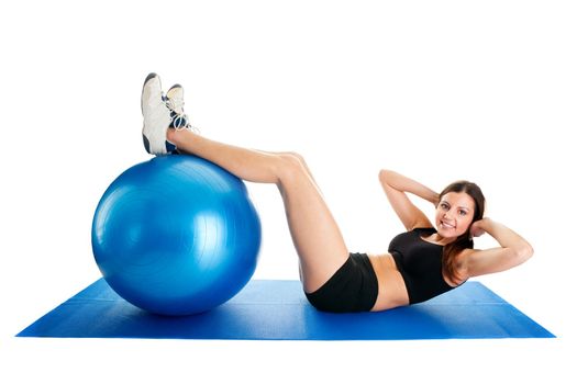 Fitness woman doing crunches on gym mat. Isolated on white