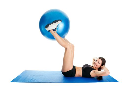 Fitness woman doing crunches on gym mat. Isolated on white