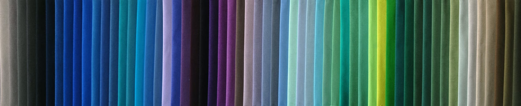 Many fabric color samples together as color spectrum.