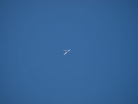 the aeroplane on the blue sky