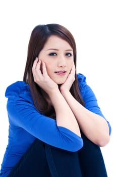 Portrait of a beautiful young woman with hands on her face over white background.