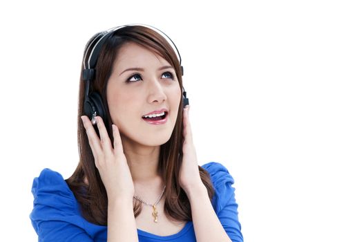 Portrait of a beautiful young woman listening to music over white background.