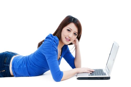 Portrait of a cute young woman using laptop over white background.