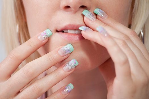 Sensual women with acrylic fingernails. Close-up shot