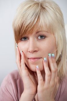 Protrait of beautiful girl with acrylic fingernails