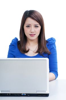 Portrait of an attractive young woman using laptop  over white background.
