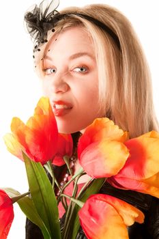 Pretty toung blonde woman with colorful plastic tulips