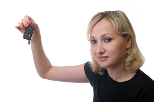 The smiling girl keeps car keys, is isolated, a white background.