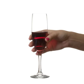 The female hand keeps a glass with red wine.