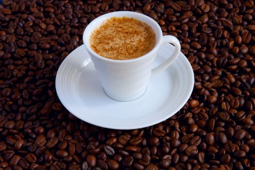 Cup with coffee, costing on coffee grain