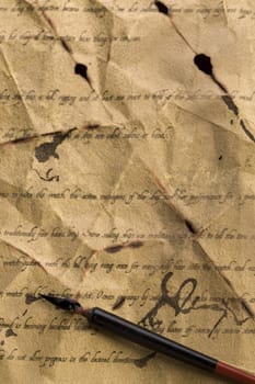 A beautiful old feather on an old letter