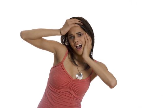 Girl teenager holding her face with surprised expression