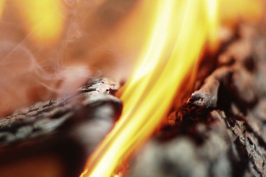Macro burning and smoked fire woods. Shallow depth of field.