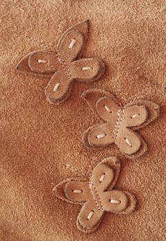 Close up shot of a butterfly made out of suede.