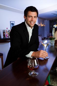 Man at the bar with martini glass