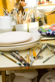 Workplace in the artist's studio. Brushes, tools and materials