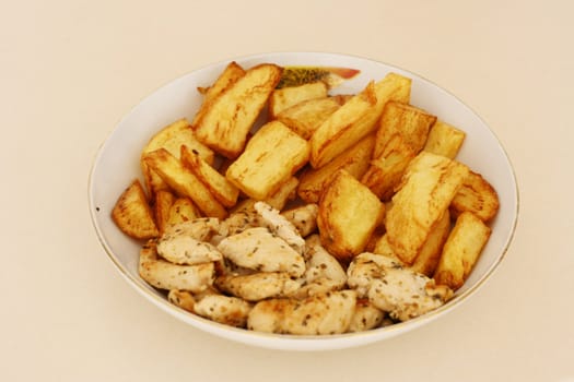 Close up shot of grilled chicken and roasted potatoes.